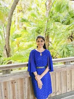 A person in a blue dress

AI-generated content may be incorrect.